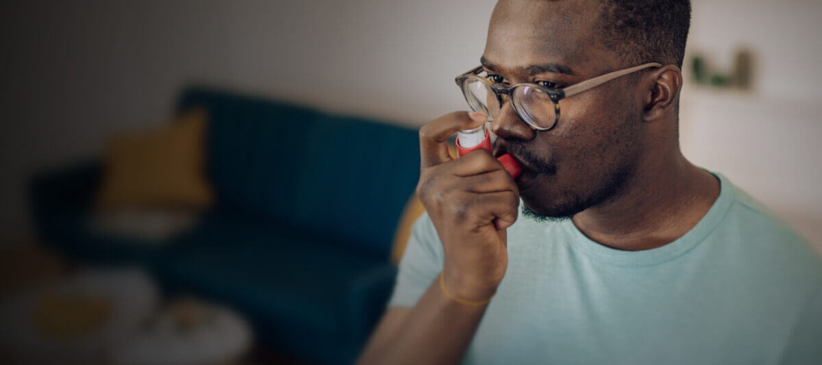 Man using an inhaler